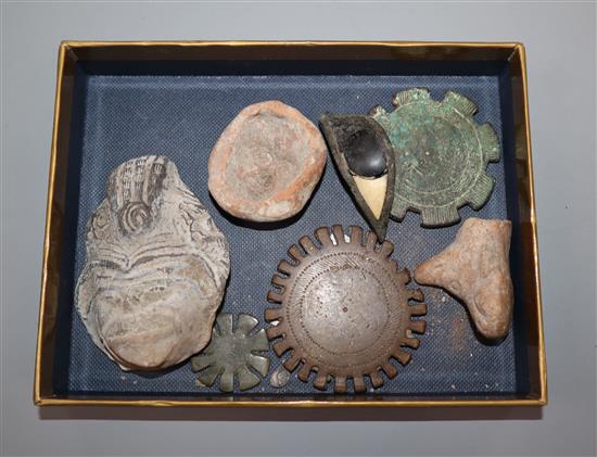 A bronze and stone Egyptian eye and other artefacts